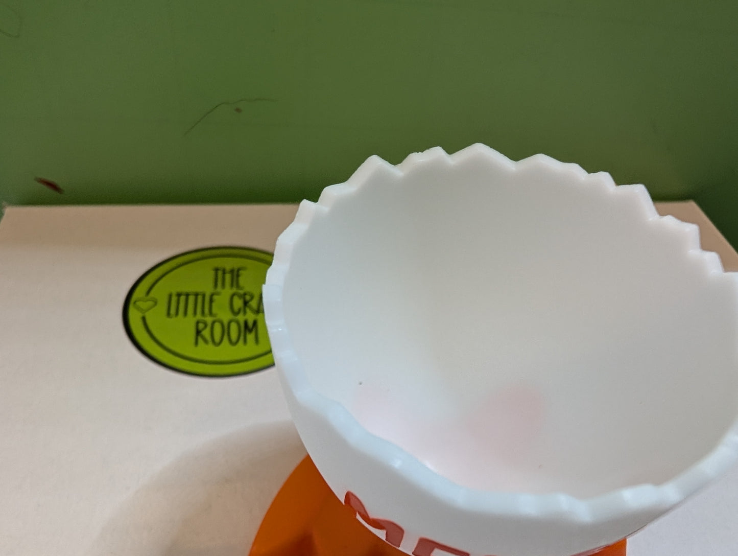 Plastic egg cup with feet