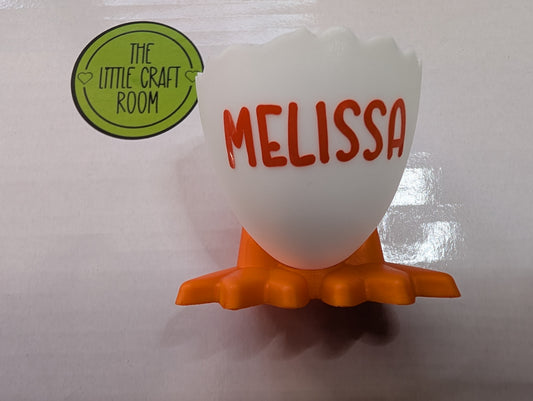 Plastic egg cup with feet