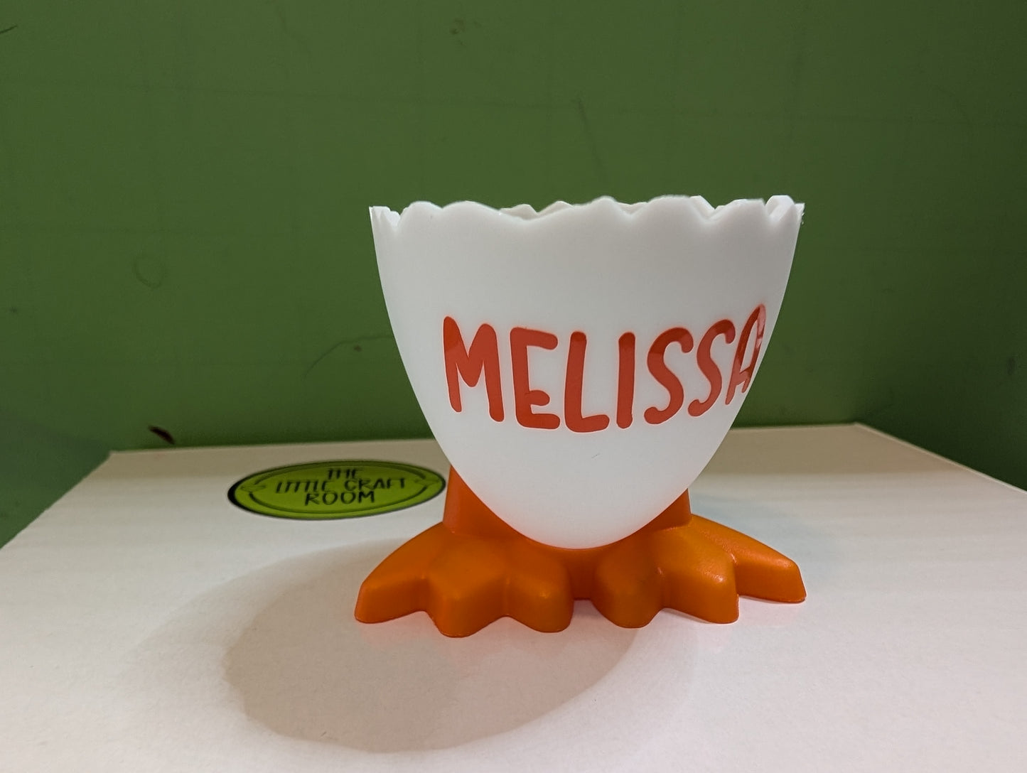 Plastic egg cup with feet